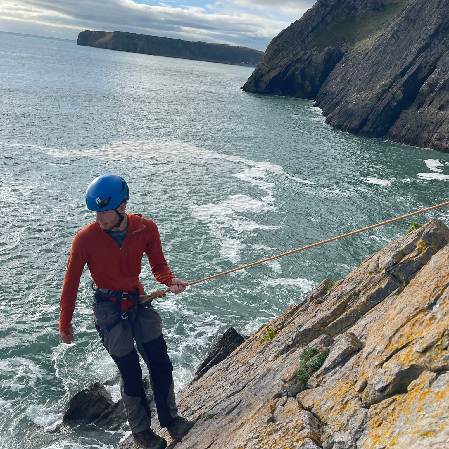 Pembrokeshire Coastal Adventure's instructor is abseiling at Newton Head.